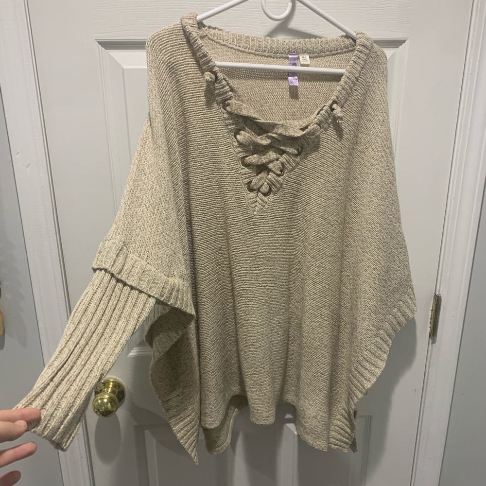 Warm tan colored poncho with sleeves, size M/L.